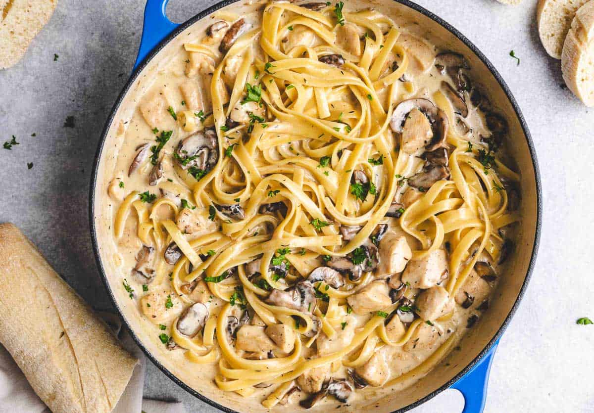 Close up view of a pan of chicken mushroom pasta.