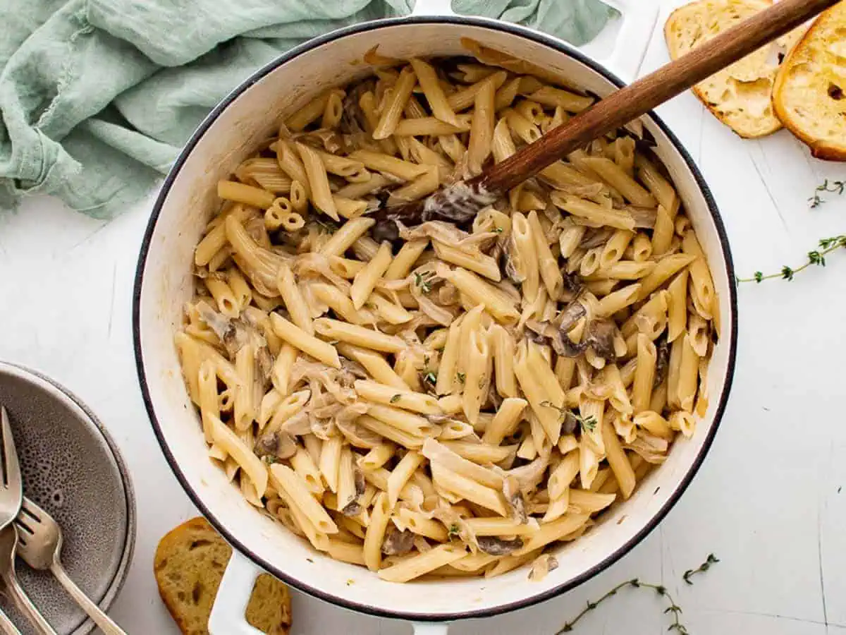 Top down view of a pan of french onion pasta.