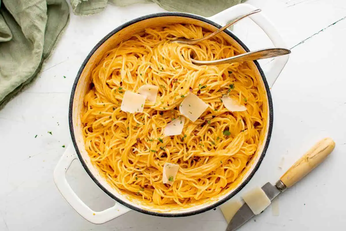 Top down view of a pan of roasted red pepper pasta.