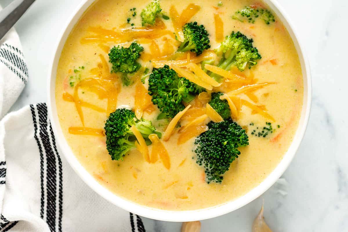 White bowl filled with broccoli cheddar soup.