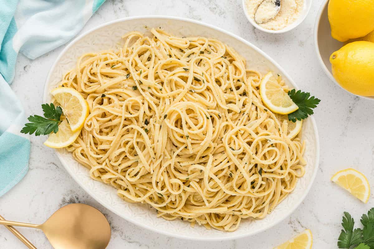 Lemon basil pasta on a white serving platter.