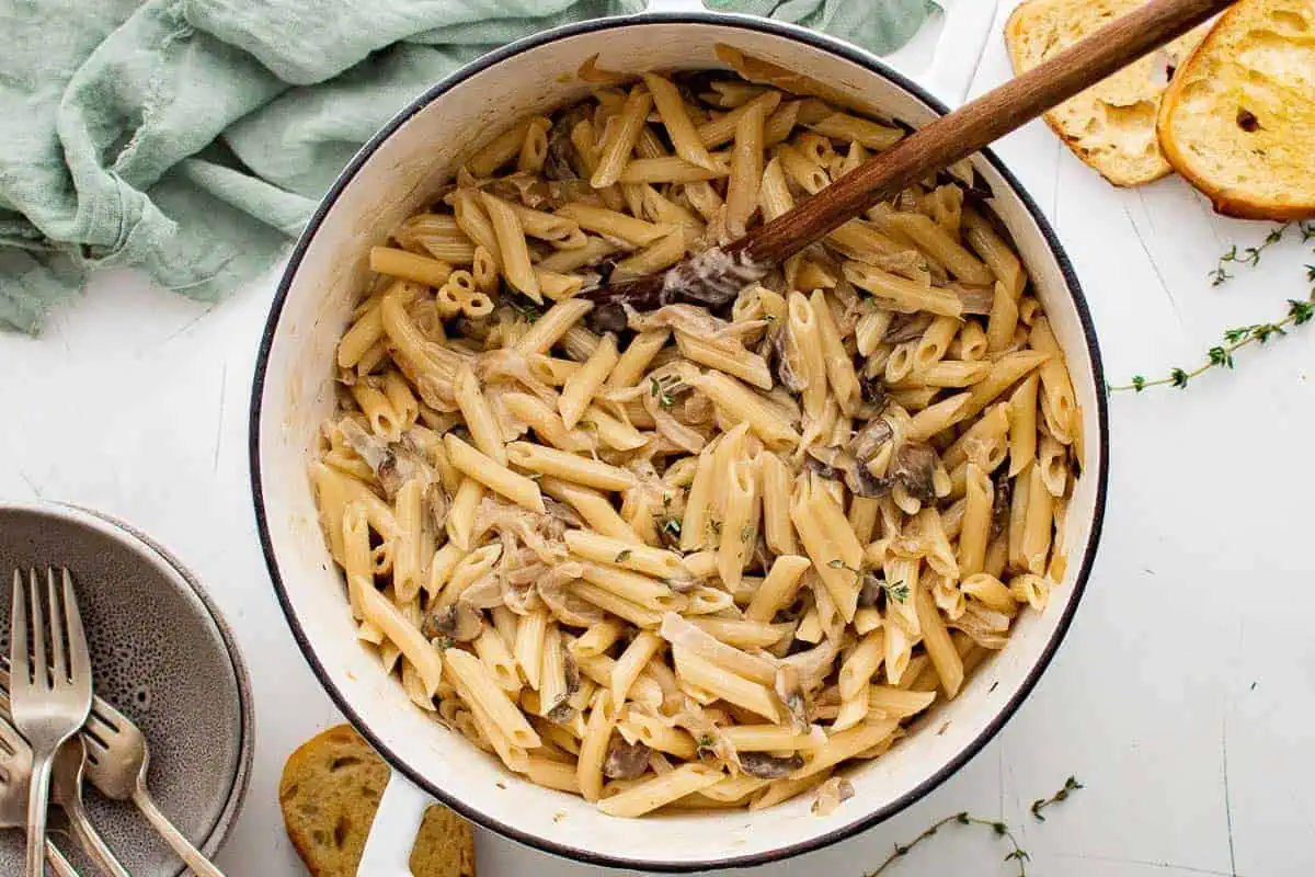 Large pot filled with french onion pasta.