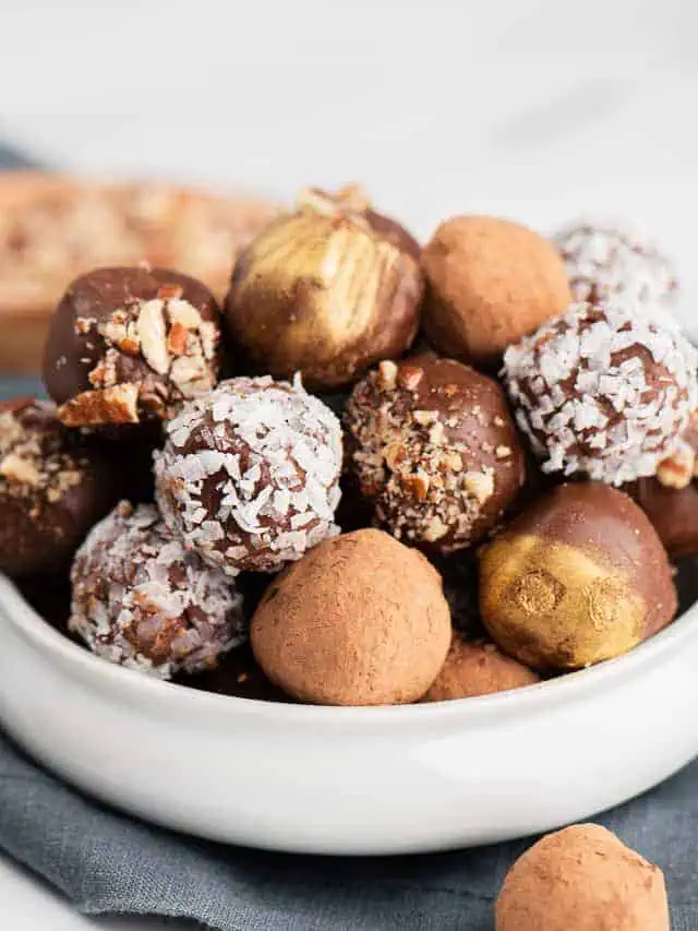 Chocolate candies in a white bowl.