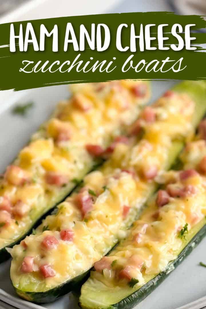 Close up view of stuffed zucchini boats on a plate.