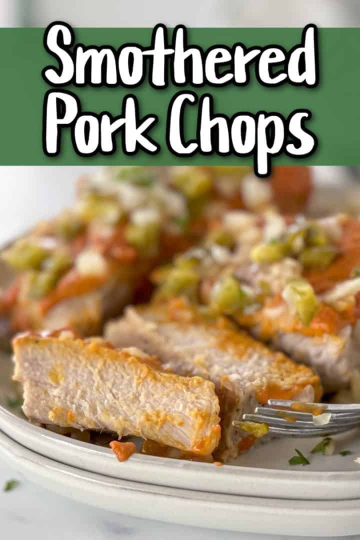 Pork chops on a gray plate.