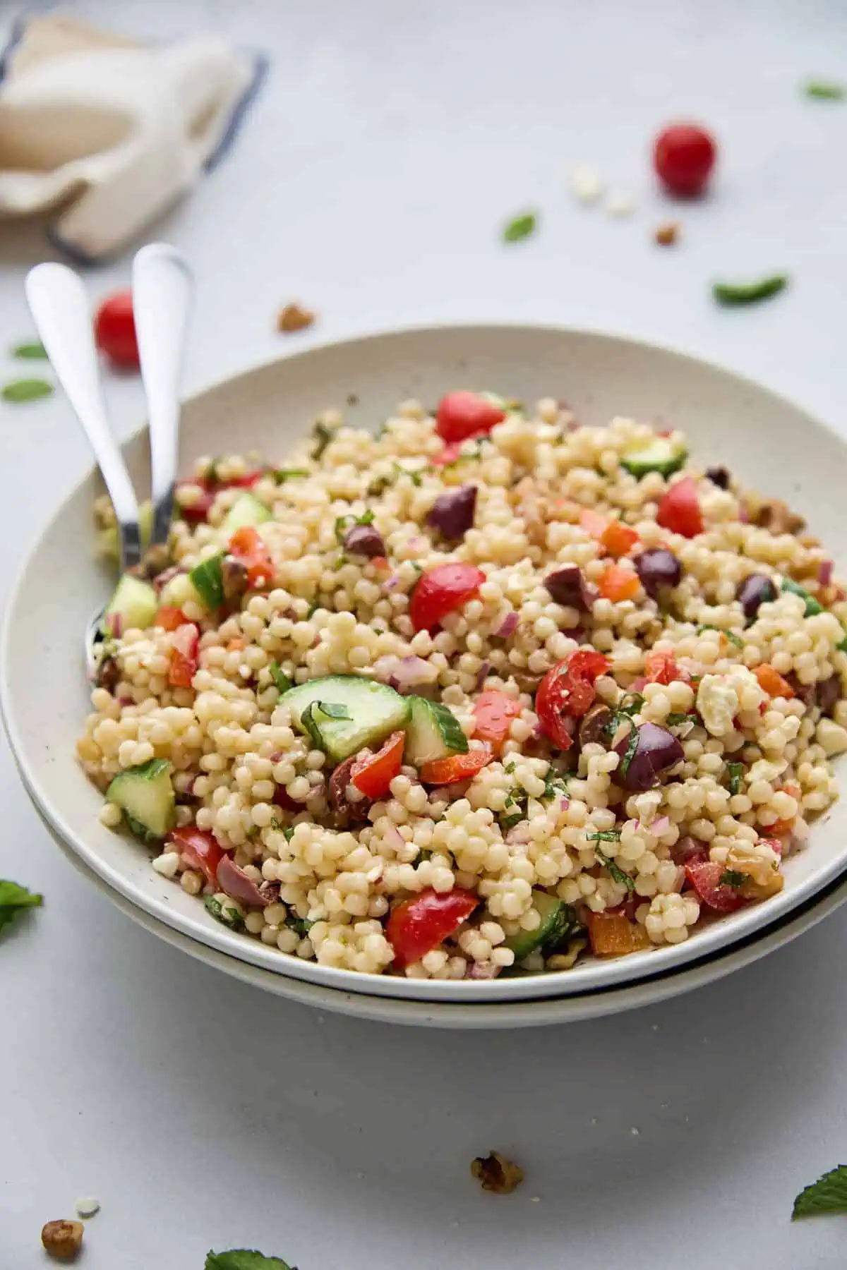 Fresh and colorful salad made with israeli couscous, diced vegetables, and a lemon olive oil dressing.