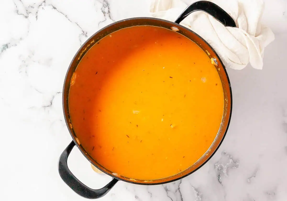 A pot of blended butternut squash and sweet potato soup.