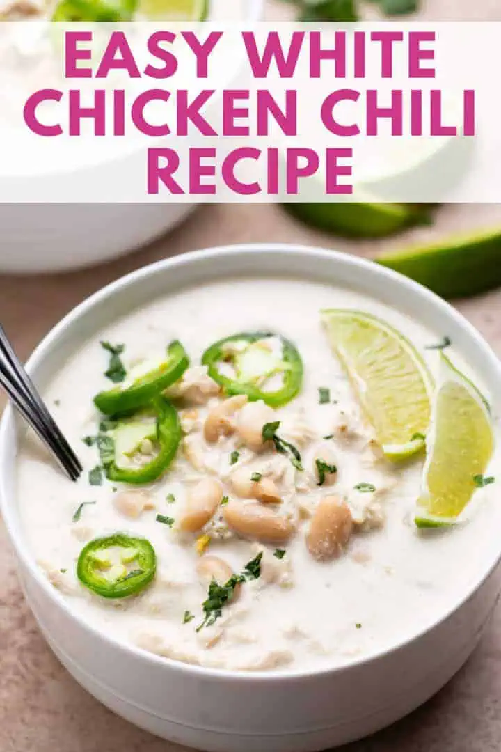 Creamy white chicken chili from a slow cooker, topped with lime and jalapeño, a cheap and easy crockpot recipe perfect for fall.