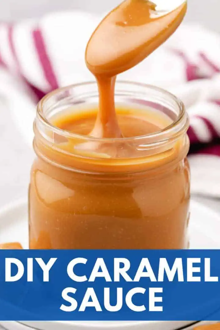 A jar of rich, creamy caramel sauce with a spoon.