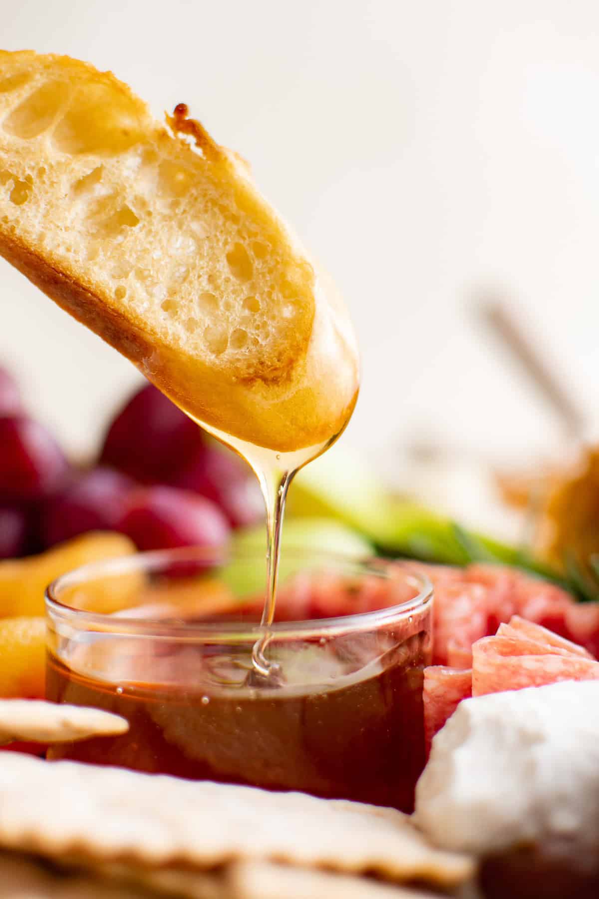 Bread being dipped into honey.