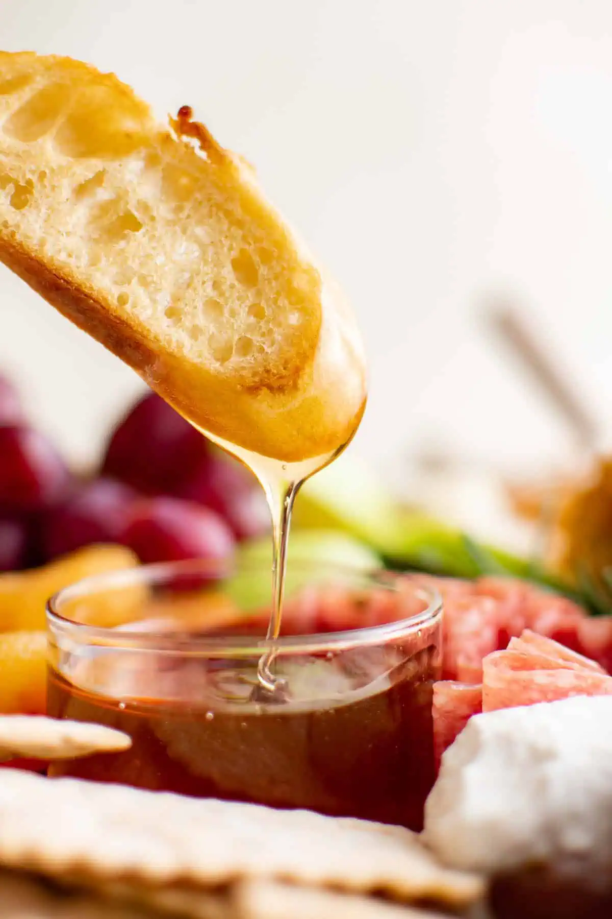 Bread being dipped into honey.