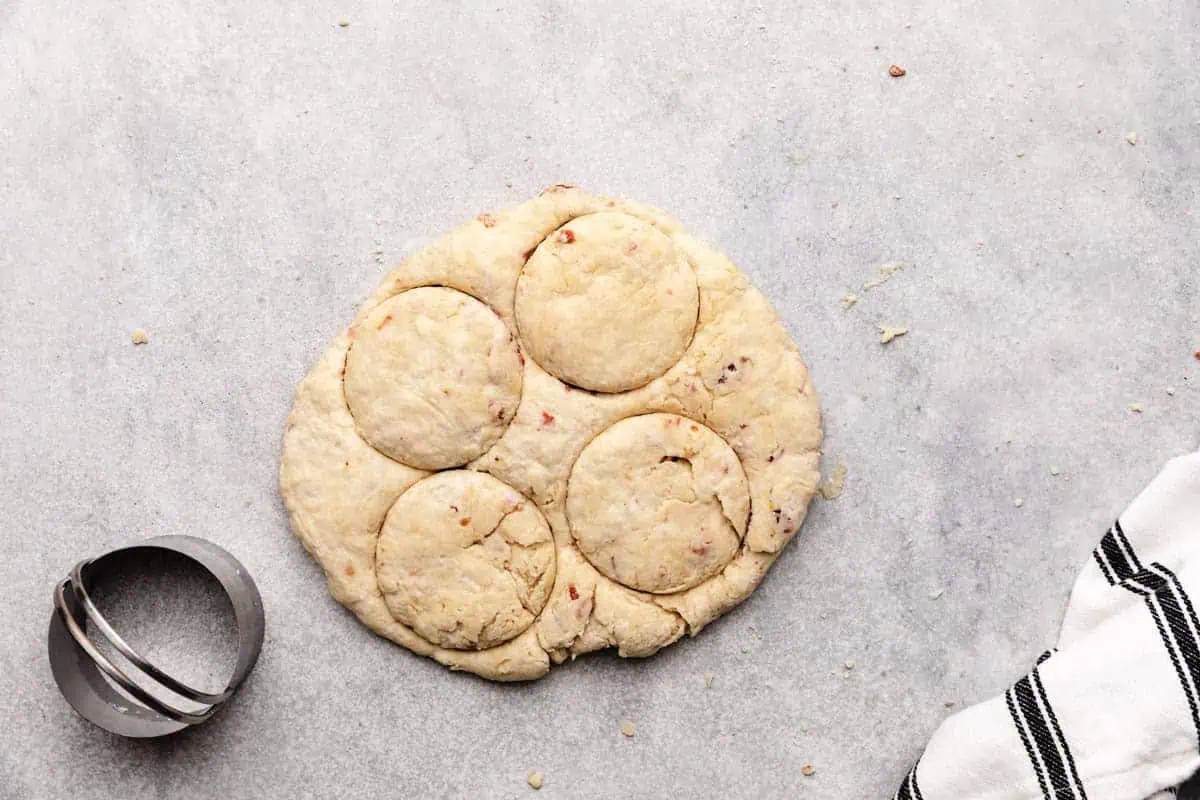 Biscuit down being cut into circles.