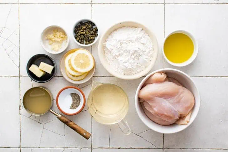 Overhead view of ingredients used in chicken piccata.