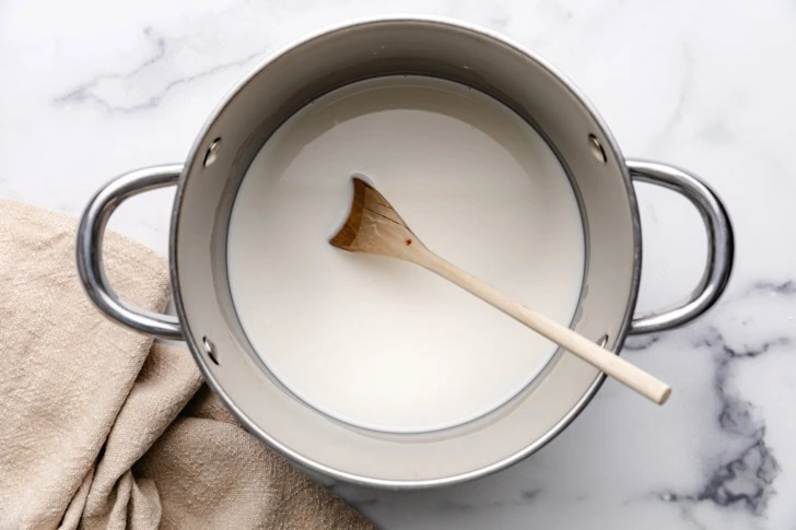 Warm milk in a saucepan.