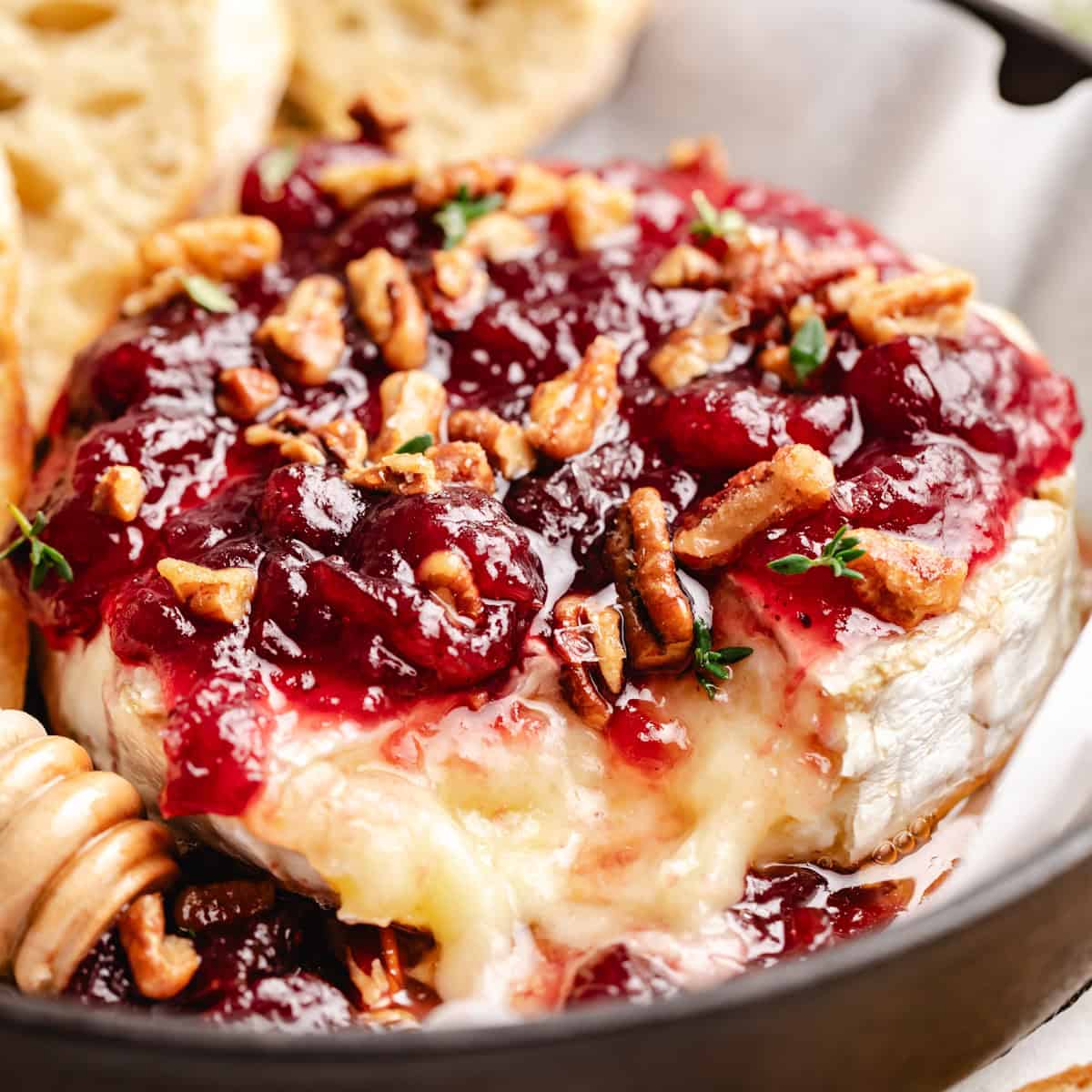 Close up view of baked with cranberry sauce and pecans.