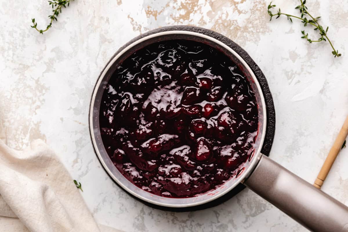 Canned cranberry sauce in a pan.