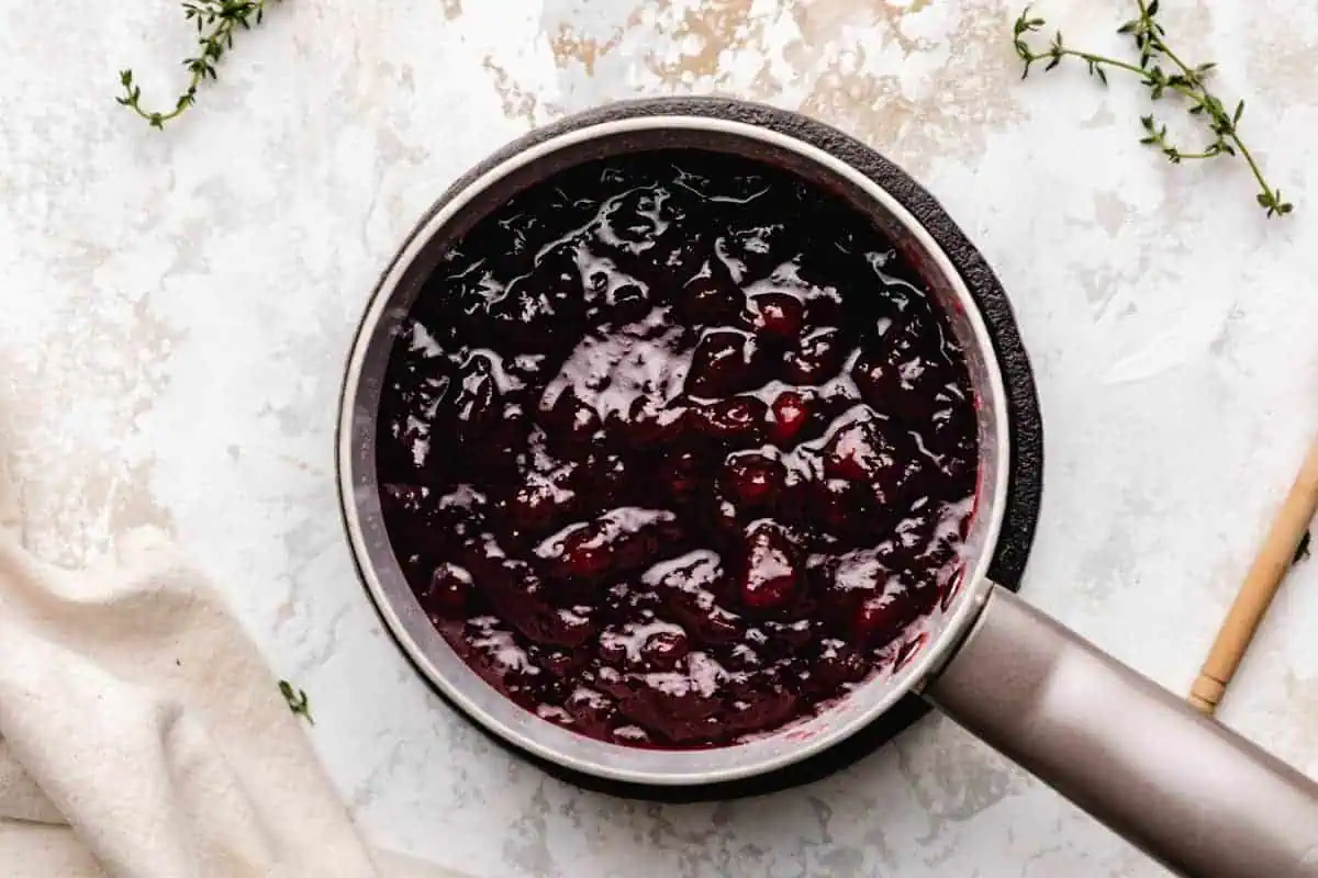 Canned cranberry sauce in a pan.