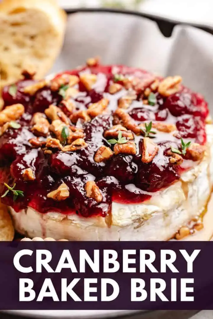 Close up view of cranberry sauce topped brie.