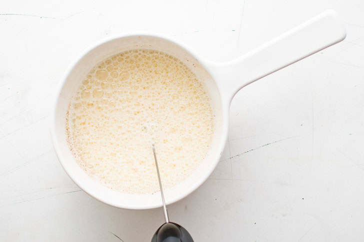 Frothed milk in a pan.