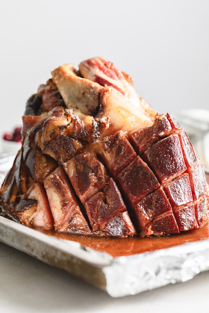 Christmas ham on a baking sheet.