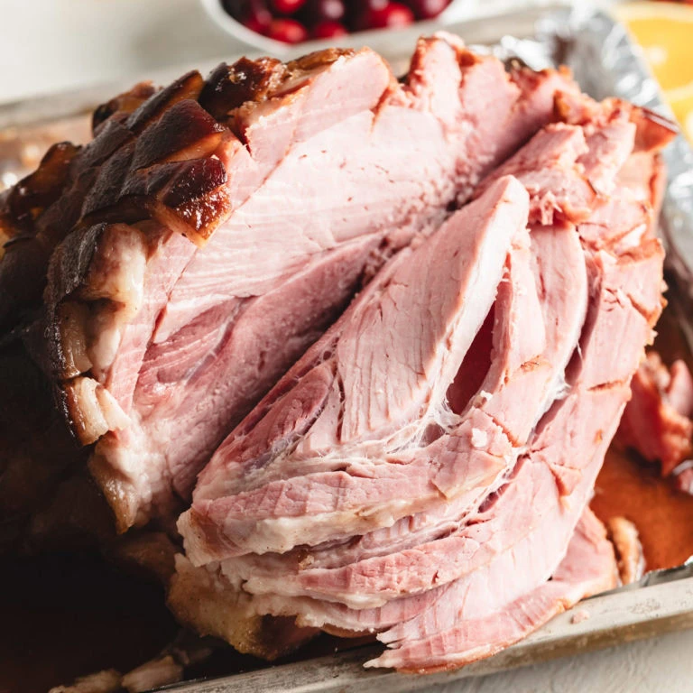 Close up view of sliced maple brown sugar glazed ham.