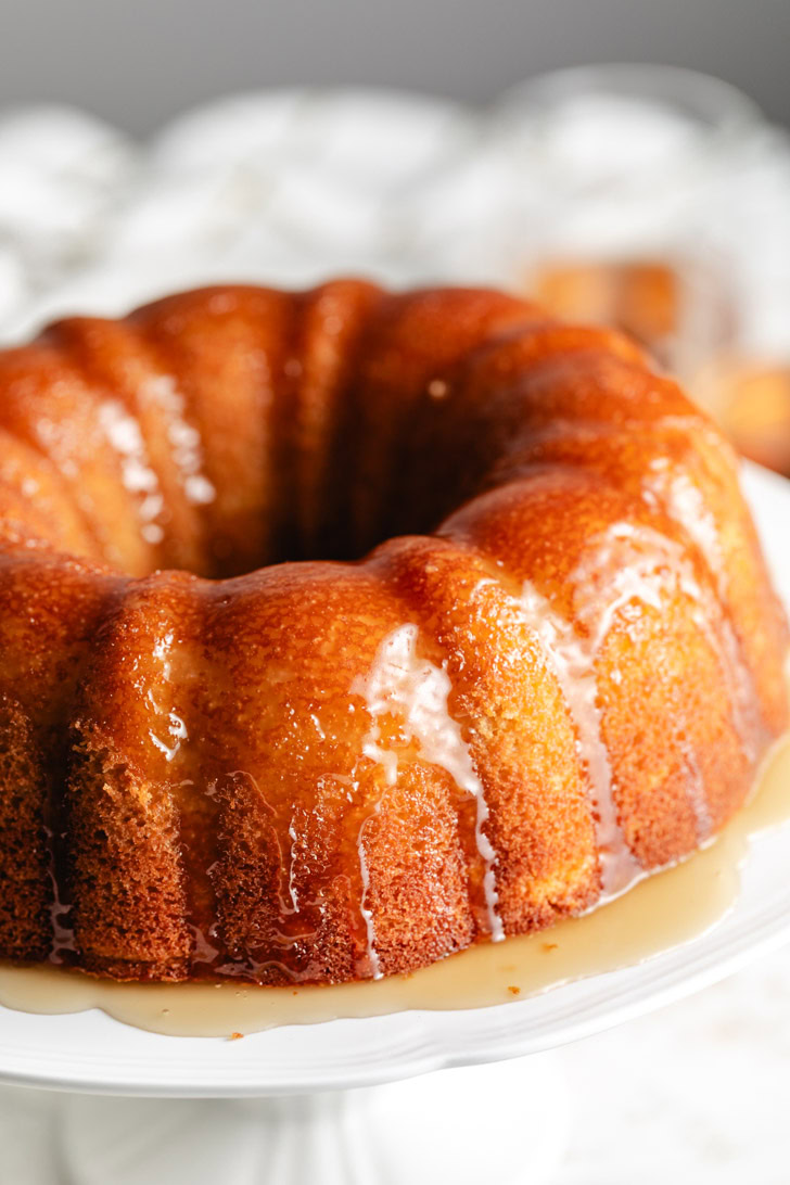 Butter rum syrup drizzled over a bundt cake.