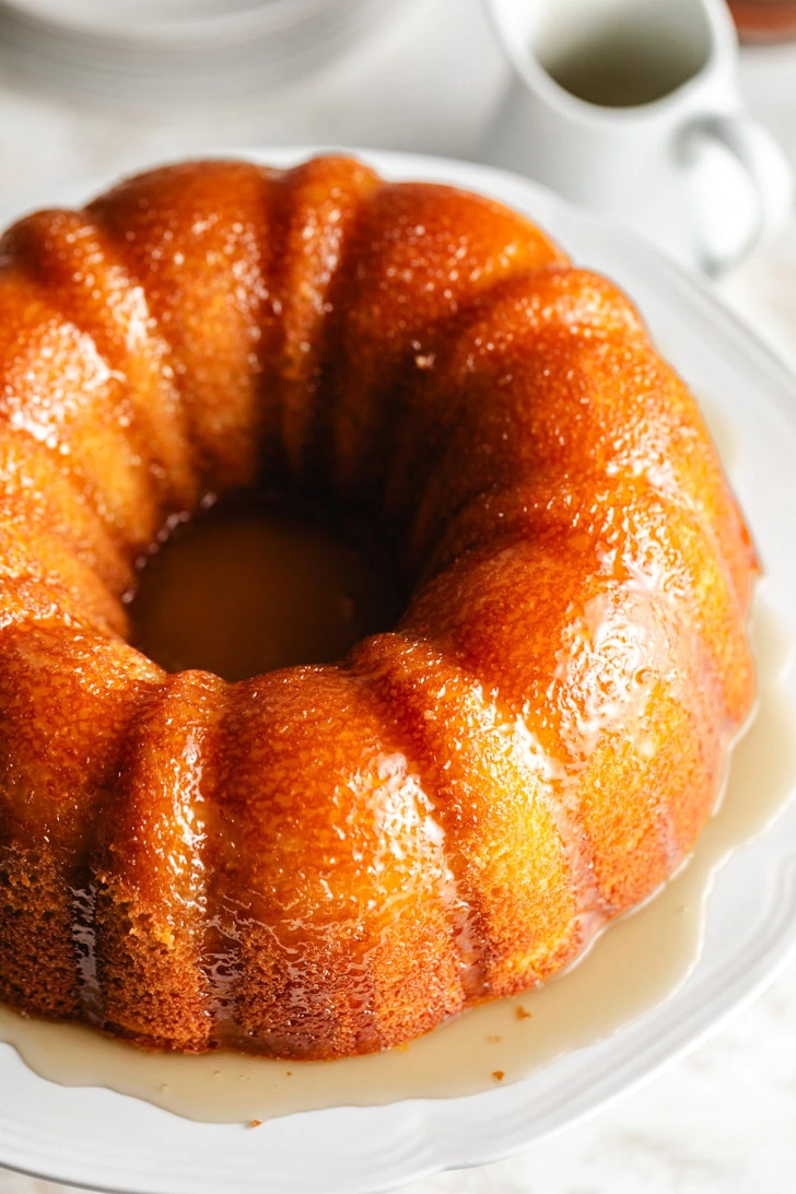 Overhead view of rum cake with sauce.