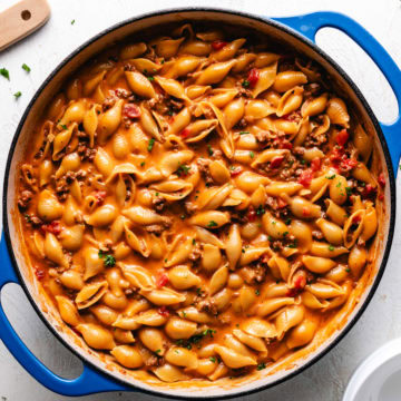 Close up view of one pot cheeseburger pasta in a blue pan.