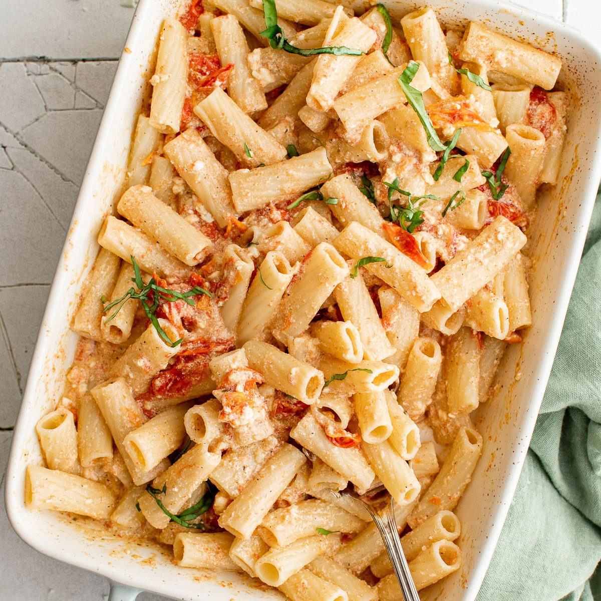 Overhead view of feta pasta in a white dish.