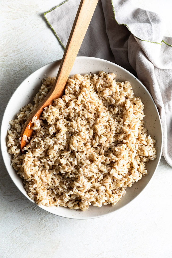 Instant Pot Brown Rice Overhead view of a speckled bowl filled with instant pot brown rice.