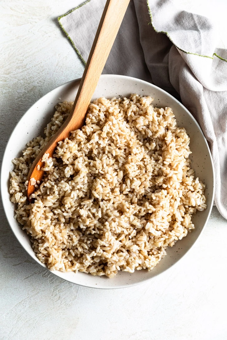 Overhead view of a speckled bowl filled with instant pot brown rice.