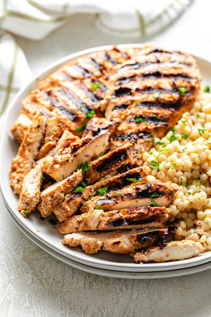 Grilled chicken breasts marinated in yogurt.