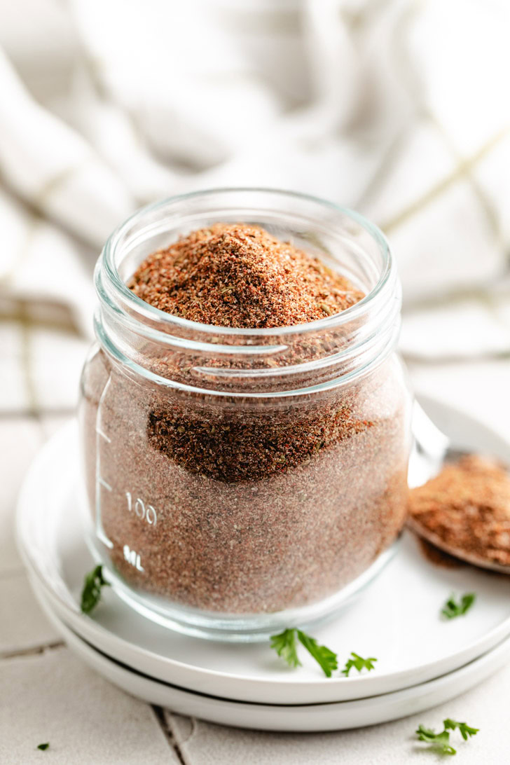 A close-up of a spice blend in a jar.