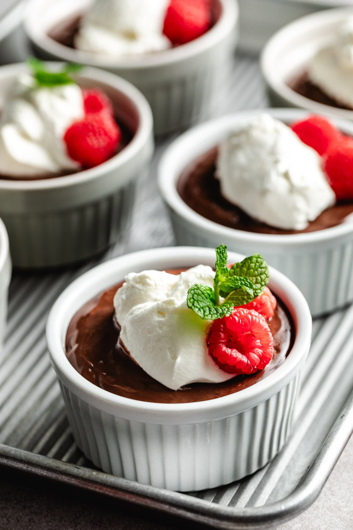 A ramekin of creamy chocolate pudding.