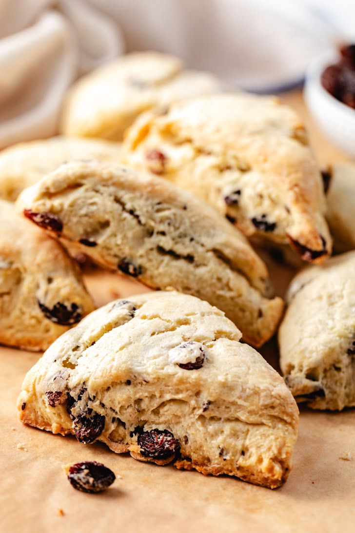 A batch of scones with raisins.