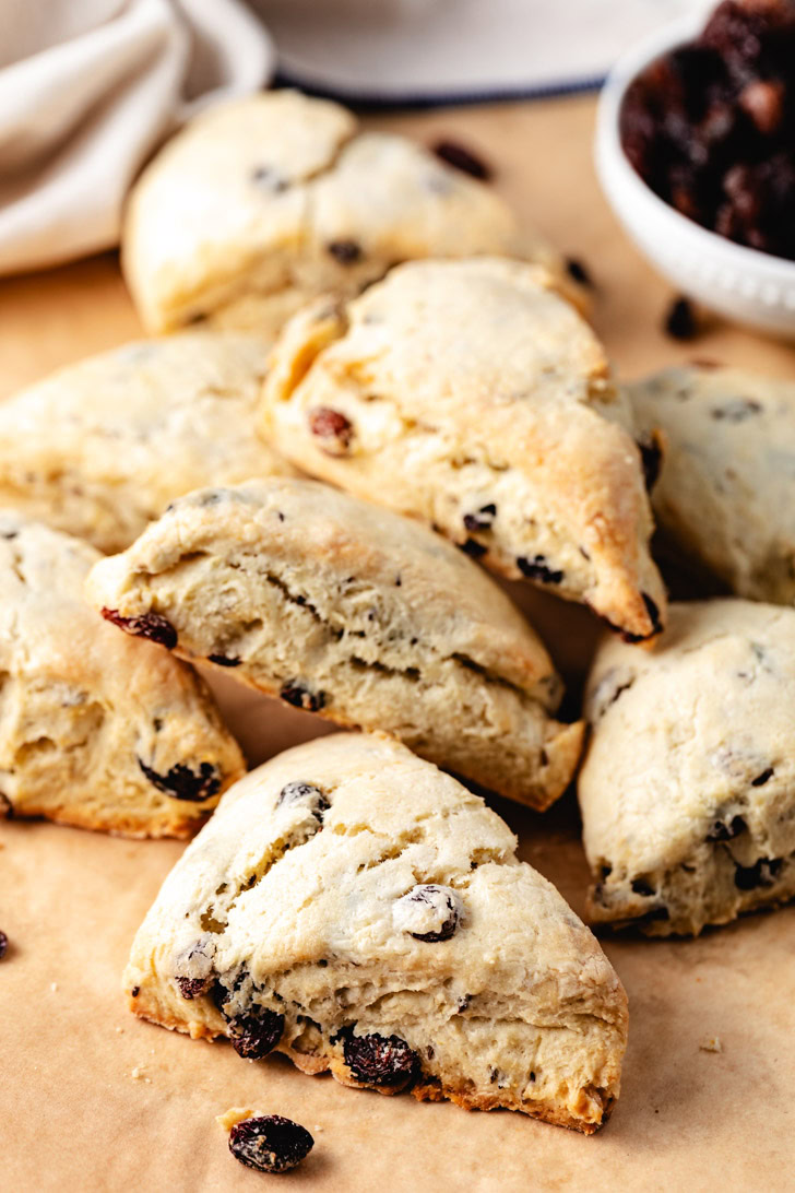 Irish soda bread scones with raisins on parchment.