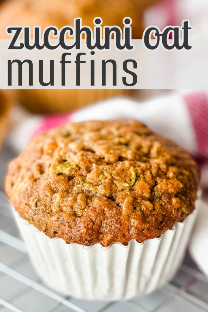 Close up view of a muffin on a wire rack.