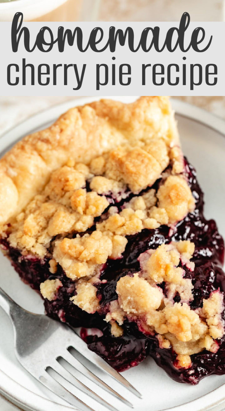 A slice of cherry pie with a crisp crumb topping on a plate with a fork.
