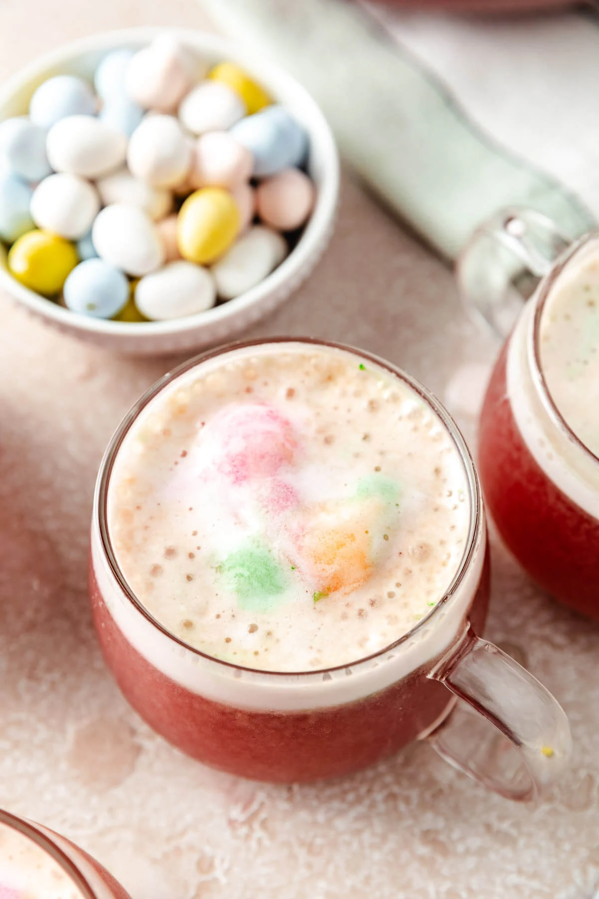 A serving of sherbet punch in a clear glass mug.