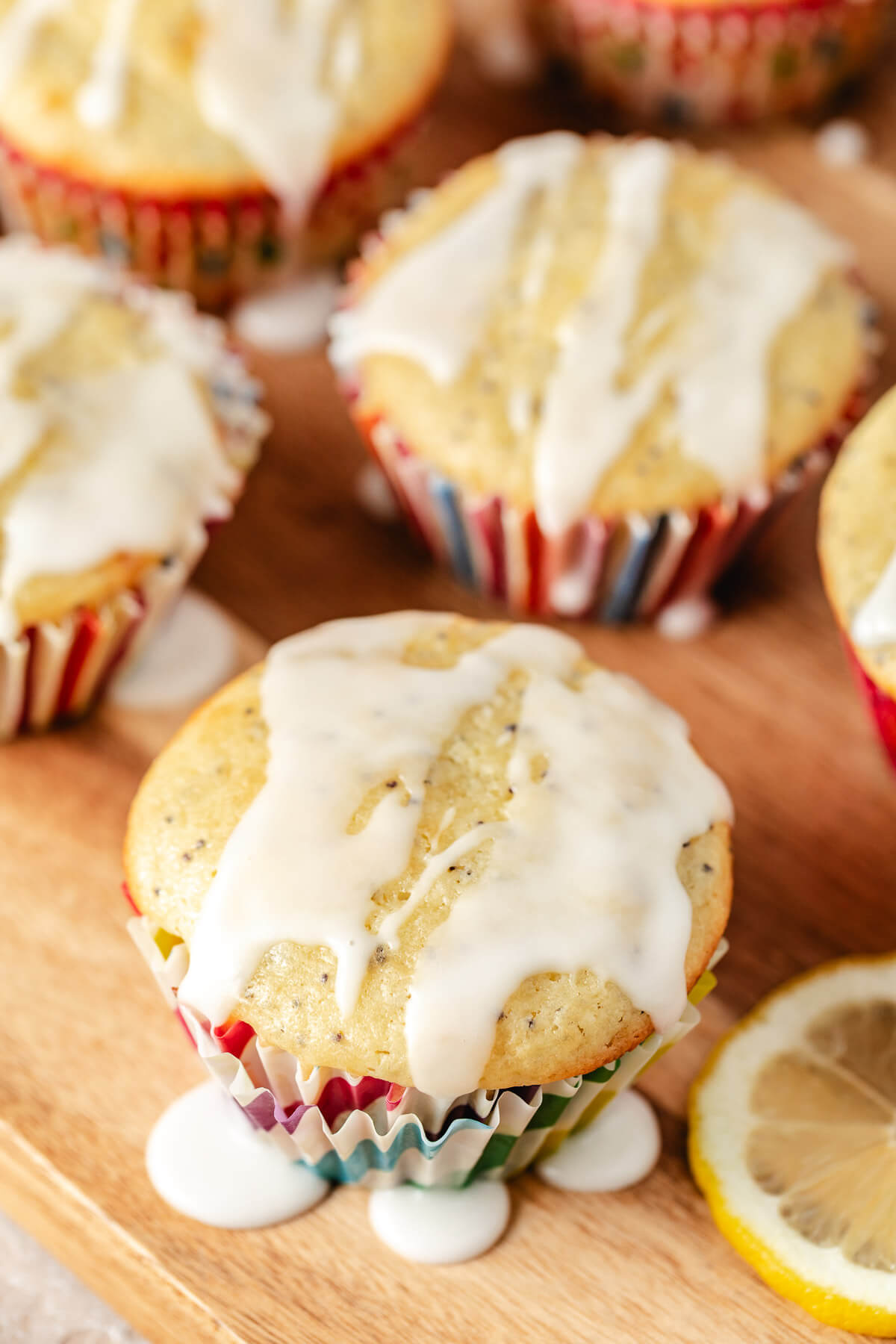 Angled view of muffins on a wooden board.