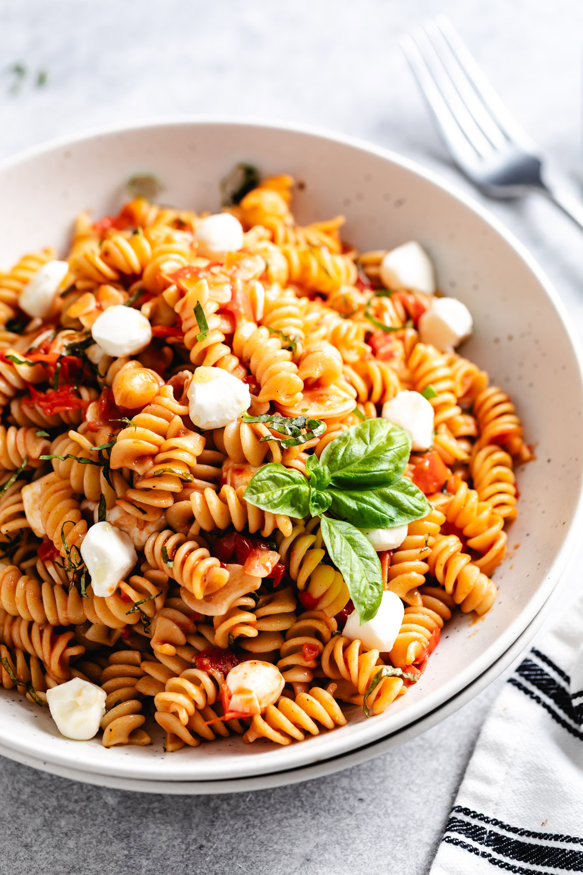A bowl of caprese pasta.