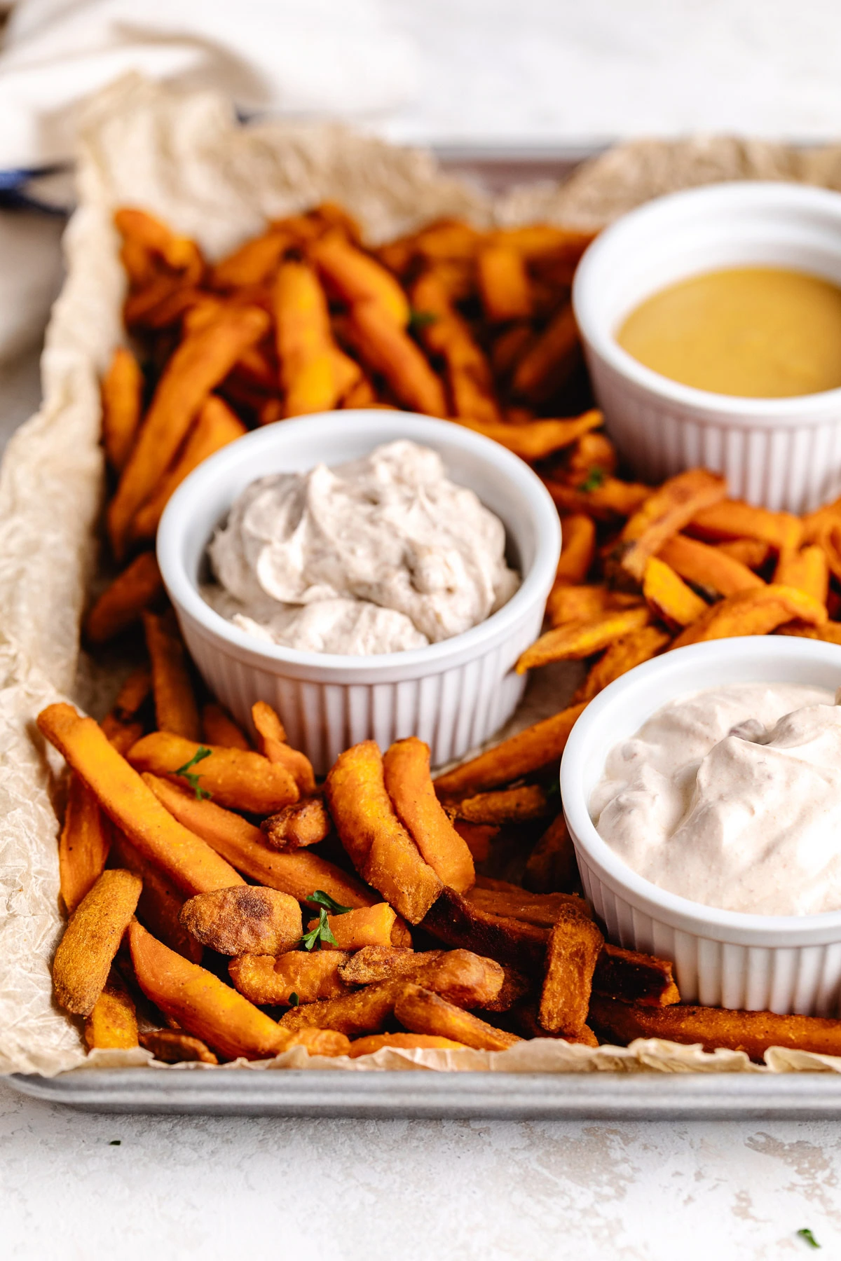 A plate of french fries and dips