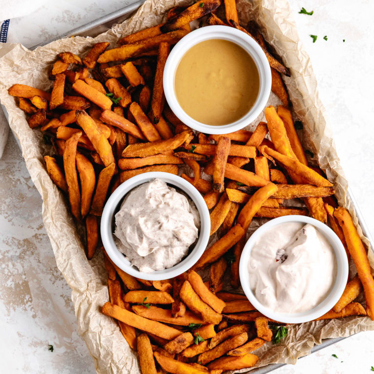 Sweet potatoes fries with three different dipping sauces.