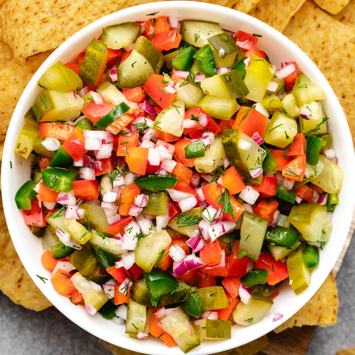 Close up view of pickle de gallo in a white bowl.