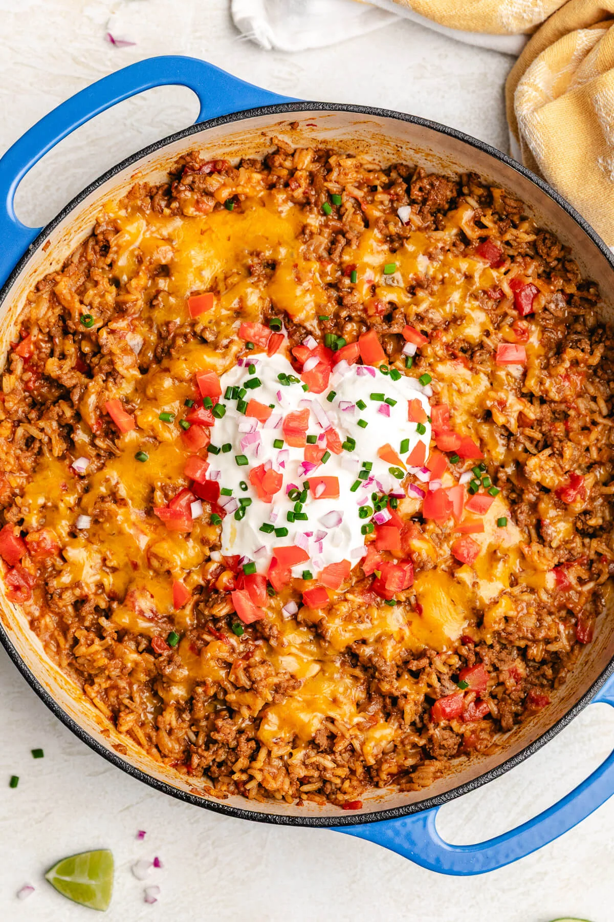 One Pot Taco Rice Melted cheese over a pan of beef rice.