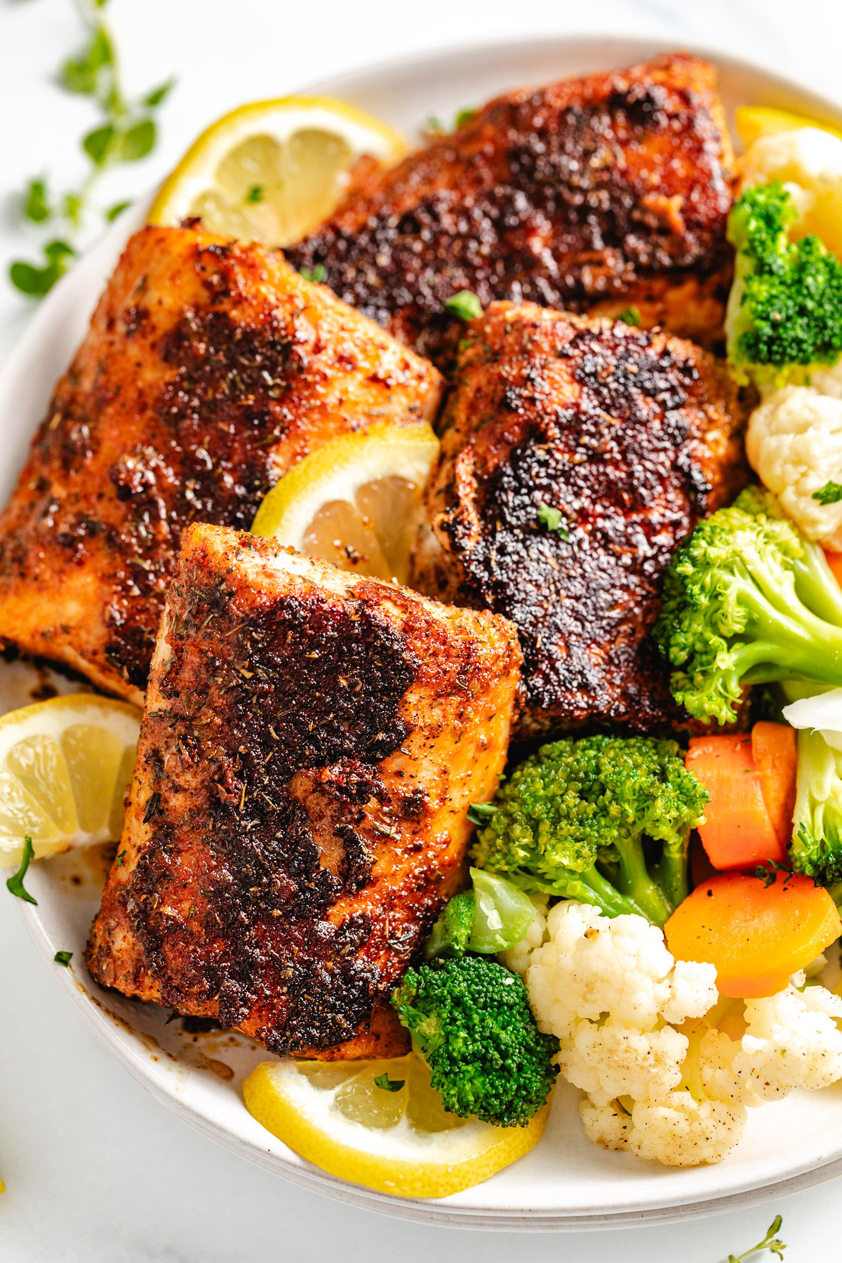 Blackened Mahi Mahi Blackened mahi mahi with lemon and vegetables.