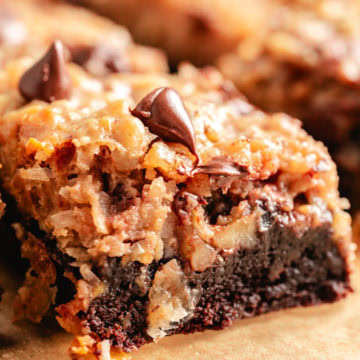 Close up view of brownie with coconut-pecan topping.