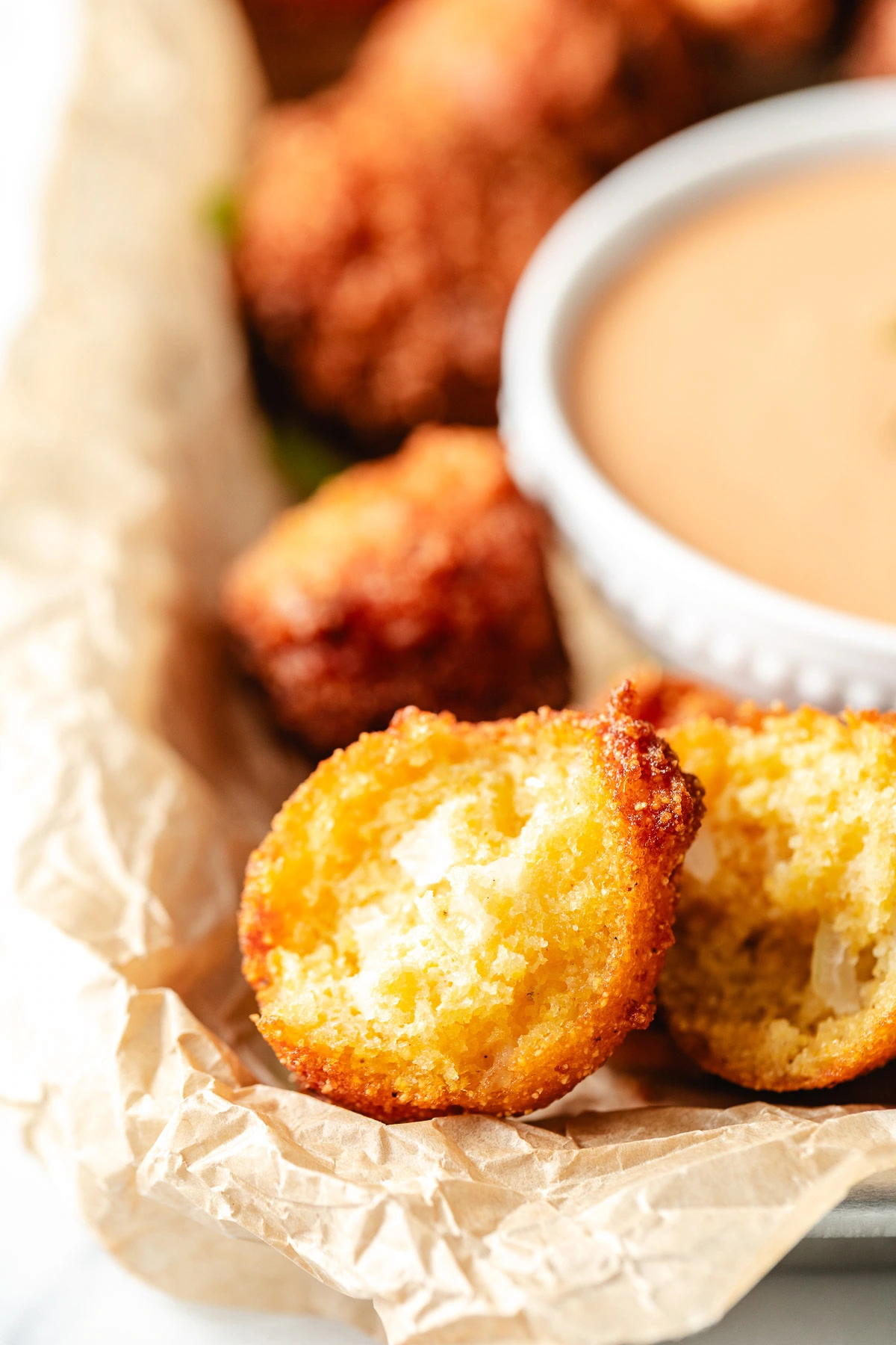 Half a hush puppy on a pan.