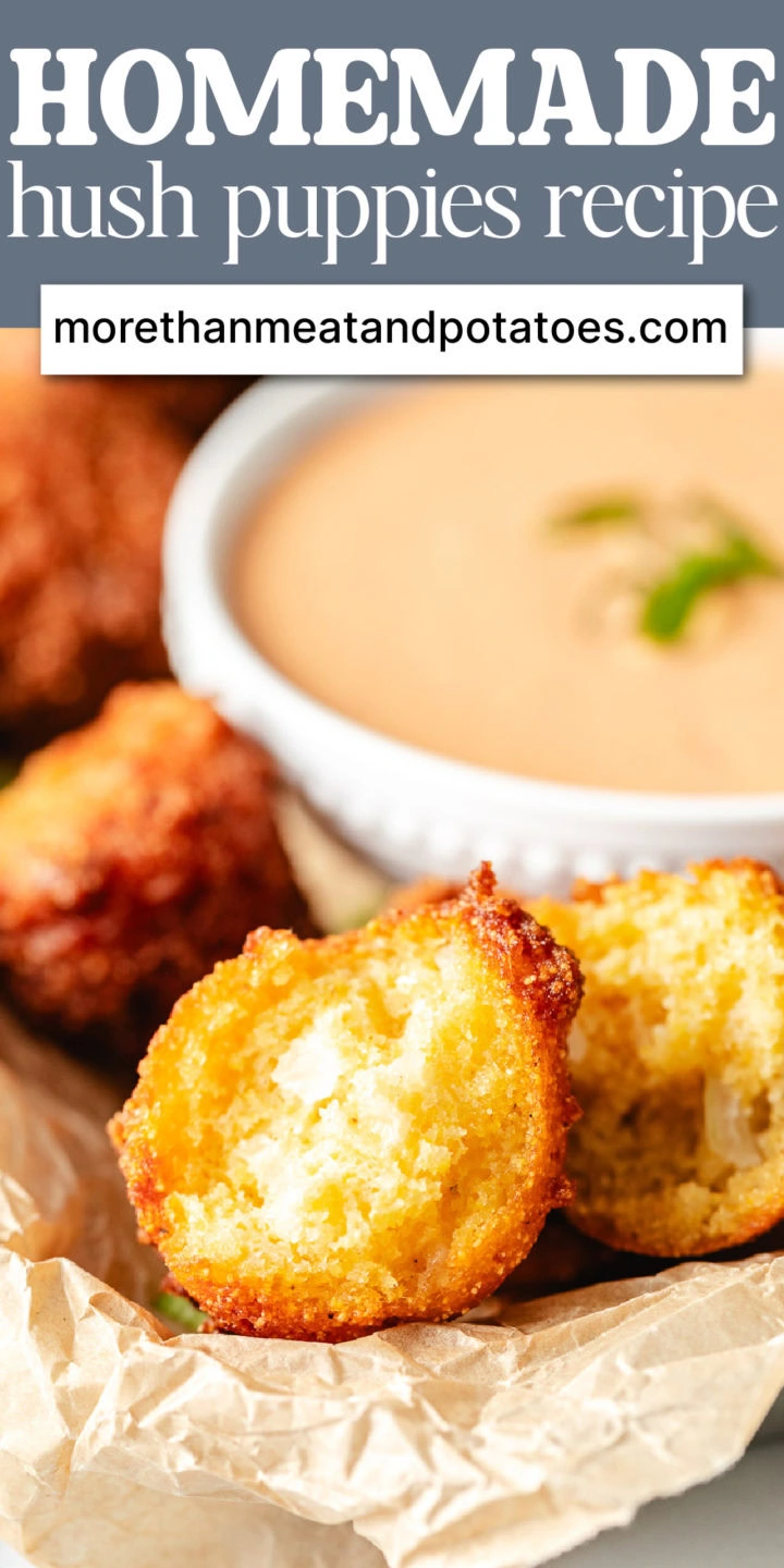 Hush puppy torn in half next to dipping sauce.