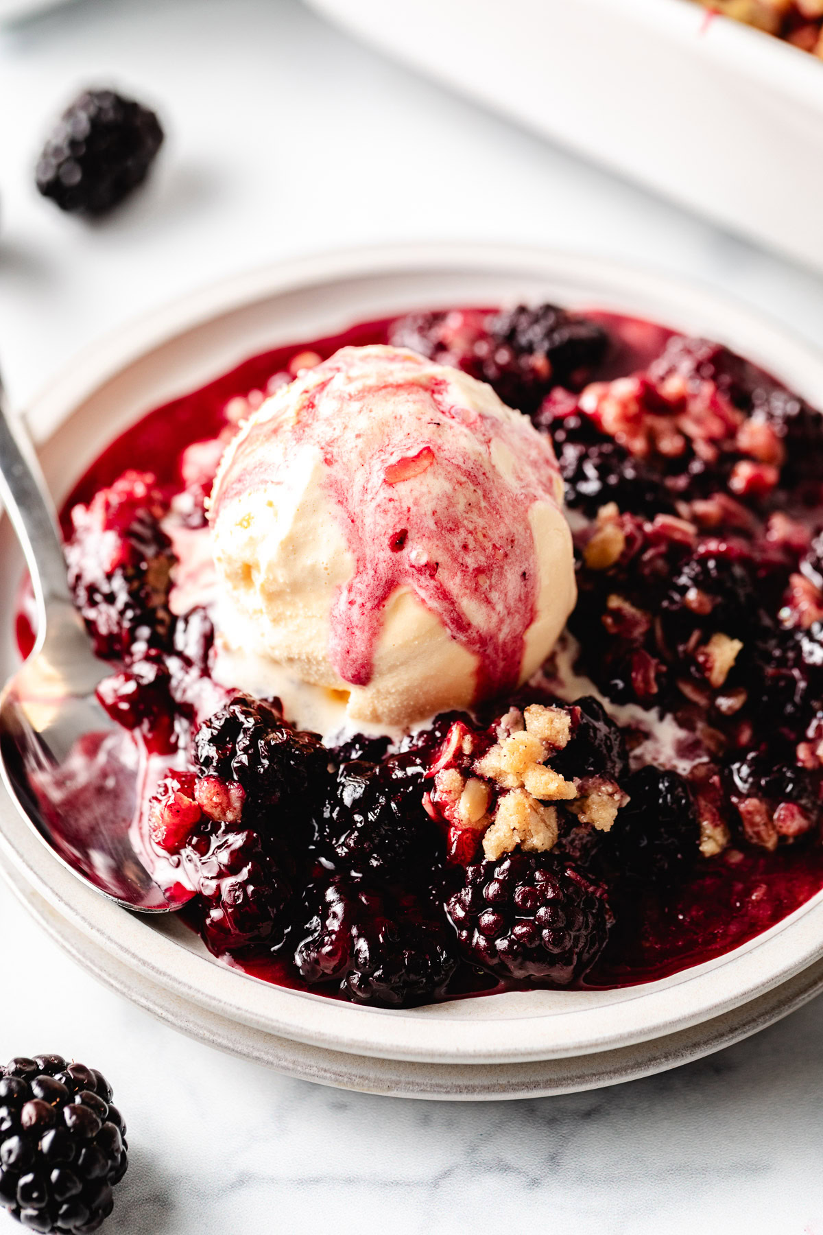 Blackberry crisp on a plate.